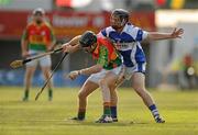26 June 2010; Edward Coady, Carlow, in action against John Brophy, Laois. GAA Hurling All-Ireland Senior Championship Qualifier Preliminary Round, Carlow v Laois, Dr. Cullen Park, Carlow. Photo by Sportsfile