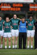 26 June 2010; Dermot Earley, 9, Kildare, stands with his team manager Kieran McGeeney and team mates during the National Anthem. GAA Football All-Ireland Senior Championship Qualifier Round 1, Kildare v Antrim, St Conleth's Park, Newbridge, Co. Kildare. Picture credit: Matt Browne / SPORTSFILE