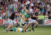 26 June 2010; James Rigney, Offaly, in action against Joe Canning, left, and Iarla Tannian, Galway. Leinster GAA Hurling Senior Championship Semi-Final Replay, Galway v Offaly, O'Moore Park, Portlaoise, Co. Laois. Picture credit: Brendan Moran / SPORTSFILE