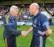 26 June 2010; Wicklow manager Mick O'Dwyer and Cavan manager Tommy Carr shake hands before the GAA Football All-Ireland Senior Championship Qualifier Round 1 match between Cavan and Wicklow at Kingspan Breffni Park in Cavan. Photo by Oliver McVeigh/Sportsfile