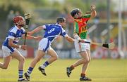26 June 2010; Eoin Nolan, Carlow, in action against Zane Keenan, left, and James Walsh, Laois. GAA Hurling All-Ireland Senior Championship Qualifier Preliminary Round, Carlow v Laois, Dr. Cullen Park, Carlow. Photo by Sportsfile