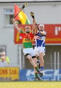 26 June 2010; Michael McEvoy, Laois, in action against Alan Corcoran, Carlow. GAA Hurling All-Ireland Senior Championship Qualifier Preliminary Round, Carlow v Laois, Dr. Cullen Park, Carlow. Photo by Sportsfile