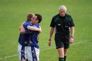 26 June 2010; Longford players Seamus Hannon, left, and Diarmuid Masterson celebrate as referee Gearoid O Conamhna leaves the field.  GAA Football All-Ireland Senior Championship Qualifier Round 1, Longford v Mayo, Pearse Park, Longford. Picture credit: Ray McManus / SPORTSFILE