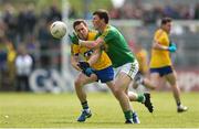 22 May 2016; James Rooney of Leitrim in action against Conor Devaney of Roscommon during the Connacht GAA Football Senior Championship Quarter-Final, between Roscommon and Leitrim at Páirc Seán Mac Diarmada in Carrick-on-Shannon, Co. Leitrim. Photo by Ramsey Cardy/Sportsfile