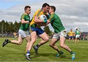 22 May 2016; Diarmuid Murtagh of Roscommon is tackled by Michael McWeeney of Leitrim during the Connacht GAA Football Senior Championship Quarter-Final between Leitrim and Roscommon at Páirc Seán Mac Diarmada in Carrick-on-Shannon, Co. Leitrim. Photo by Ramsey Cardy/Sportsfile
