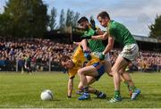 22 May 2016; Diarmuid Murtagh of Roscommon is tackled by Kevin Conlan, left, and Michael McWeeney of Leitrim during the Connacht GAA Football Senior Championship Quarter-Final between Leitrim and Roscommon at Páirc Seán Mac Diarmada in Carrick-on-Shannon, Co. Leitrim. Photo by Ramsey Cardy/Sportsfile