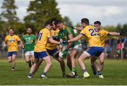 22 May 2016; Donal Wrynn of Leitrim under pressure from Ciaran Murtagh, left, Donal Shine, centre, and Senan Kilbride of Roscommon during the Connacht GAA Football Senior Championship Quarter-Final between Leitrim and Roscommon between Leitrim and Roscommon at Páirc Seán Mac Diarmada in Carrick-on-Shannon, Co. Leitrim. Photo by Ramsey Cardy/Sportsfile