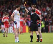 22 May 2016; Referee David Coldrick issues a yellow card to Sean Cavanagh of Tyrone and Brendan Rogers of Derry in the second half during the Ulster GAA Football Senior Championship, Quarter-Final between Derry and Tyrone at Celtic Park, Derry.  Photo by Oliver McVeigh/Sportsfile