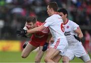 22 May 2016; Niall Holly of Derry in action against Niall Sludden and Mattie Donnelly of Tyrone during the Ulster GAA Football Senior Championship, Quarter-Final, at Celtic Park, Derry.  Photo by Oliver McVeigh/Sportsfile