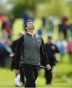 22 May 2016; Rory McIlroy of Northern Ireland reacts as he walks to his ball on the 18th green during the final round of the Dubai Duty Free Irish Open Golf Championship at The K Club in Straffan, Co. Kildare. Photo by Diarmuid Greene/Sportsfile
