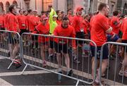 22 May 2016; Runners stretch and warm up ahead of the 2016 Virgin Media Night Run in Dublin City Centre, Dublin. Photo by Seb Daly/Sportsfile