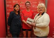 22 May 2016; Deirdre Byrne, centre, is presented with her prize by Georgina Drumm, right, President Athletics Association of Ireland, and Karen O'Connor, left, Virgin Media Senior Marketing Manager, after winning the female category during the 2016 Virgin Media Night Run in Dublin City Centre, Dublin.  Photo by Seb Daly/Sportsfile