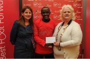 22 May 2016; Peter Somba, centre, is presented with his prize by Georgina Drumm, right, President Athletics Association of Ireland, and Karen O'Connor, left, Virgin Media Senior Marketing Manager, after finishing second in the 2016 Virgin Media Night Run in Dublin City Centre, Dublin.  Photo by Seb Daly/Sportsfile