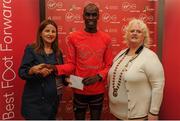 22 May 2016; Eric Koech, centre, is presented with his prize by Karen O'Connor, left, Virgin Media Senior Marketing Manager, and Georgina Drumm, right, President Athletics Association of Ireland, after finishing third in the 2016 Virgin Media Night Run in Dublin City Centre, Dublin.  Photo by Seb Daly/Sportsfile