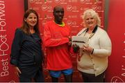 22 May 2016; Dan Tanui, centre, is presented with his prize by Georgina Drumm, right, President Athletics Association of Ireland, and Karen O'Connor, left, Virgin Media Senior Marketing Manager, after winning the 2016 Virgin Media Night Run in Dublin City Centre, Dublin.  Photo by Seb Daly/Sportsfile