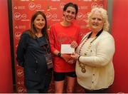 22 May 2016; Deirdre Byrne, centre, is presented with her prize by Georgina Drumm, right, President Athletics Association of Ireland, and Karen O'Connor, left, Virgin Media Senior Marketing Manager, after finishing third in the female category during the 2016 Virgin Media Night Run in Dublin City Centre, Dublin.  Photo by Seb Daly/Sportsfile