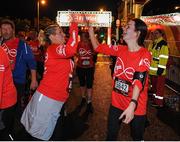 22 May 2016; Tina Kealy, left, from Gorey, Co. Wexford, and Aine Smyth, from Balbriggan, Co. Dublin, congratulate each other after finishing the 2016 Virgin Media Night Run in Dublin City Centre, Dublin.  Photo by Seb Daly/Sportsfile