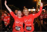 22 May 2016; Sarah Thorn, left, and Aisling Gillespie, from Co. Dublin, celebrate after finishing the 2016 Virgin Media Night Run in Dublin City Centre, Dublin.  Photo by Seb Daly/Sportsfile