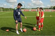 23 May 2016; Republic of Ireland's Callum O'Dowda coaches school children Leah Donovan and Caoimhe Riordan, right, from Dromtrasna NS, Abbeyfeale, Limerick, during a training session. SPAR treated this year’s SPAR FAI Primary School 5’s winners to a training session with Republic of Ireland players Jeff Hendrick, Stephen Quinn and Callum O'Dowda at the team training camp in the National Sports Campus in advance of the Republic of Ireland vs Netherlands game on Friday. SPAR is the Official Convenience Retail Partner of the FAI. National Sports Campus, Abbotstown, Dublin. Photo by Piaras Ó Mídheach/Sportsfile