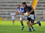 27 June 2010; Philip Austin, Tipperary, in action against Peter O'Leary, Laois. GAA Football All-Ireland Senior Championship Qualifier Round 1, Tipperary v Laois, Semple Stadium, Thurles, Co. Tipperary. Picture credit: Barry Cregg / SPORTSFILE