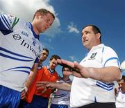 27 June 2010; Monaghan manager Seamus McEnaney, right, and his captain Vincent Corey, left, speaks to the players after the game. Ulster GAA Football Senior Championship Semi-Final, Fermanagh v Monaghan, Kingspan Breffni Park, Cavan. Picture credit: Oliver McVeigh / SPORTSFILE