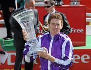 27 June 2010; Johnny Murtagh with the Dubai Duty Free Irish Derby Trophy after his win on Cape Blanco. Irish Derby Festival, the Curragh Racecourse, Curragh, Co. Kildare. Picture credit: Matt Browne / SPORTSFILE