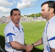 27 June 2010; Monaghan manager Seamus McEnaney, left, shakes hands with his assistant Martin McElkennon at the final whistle. Ulster GAA Football Senior Championship Semi-Final, Fermanagh v Monaghan, Kingspan Breffni Park, Cavan. Picture credit: Oliver McVeigh / SPORTSFILE