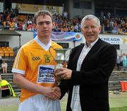 27 June 2010; Ciaran Clarke, Antrim, who was presented with the ESB Ulster GAA Hurling Minor Championship Final Man of the Match by James McHugh, ESB. Ulster GAA Hurling Minor Championship Final, Antrim v Down, Casement Park, Belfast. Picture credit: Michael Cullen / SPORTSFILE