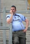 27 June 2010; A Dublin supporter watches the Westmeath v Louth game at the Leinster GAA Football Senior Championship Semi-Finals, Croke Park, Dublin. Picture credit: Ray McManus / SPORTSFILE
