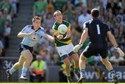 27 June 2010; Paul Flynn, under pressure from Dublin substitute Kevin Nolan, punches the ball over the bar for a point for Meath. Leinster GAA Football Senior Championship Semi-Final, Meath v Dublin, Croke Park, Dublin. Picture credit: Ray McManus / SPORTSFILE
