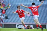 27 June 2010; Colm Judge, Louth, celebrates scoring his side's only goal with team-mate Derek Maguire, 22, as a disconsolate Kevin Maguire, Westmeath, looks on. Leinster GAA Football Senior Championship Semi-Final, Westmeath v Louth, Croke Park, Dublin. Picture credit: Brendan Moran / SPORTSFILE