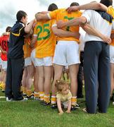 27 June 2010; A young Antrim supporter gets involved in a team huddle. Ulster GAA Hurling Senior Championship Final, Antrim v Down, Casement Park, Belfast. Picture credit: Michael Cullen / SPORTSFILE