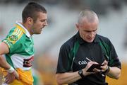 26 June 2010; Referee Martin Higgins takes the name of Ken Casey, Offaly. GAA Football All-Ireland Senior Championship Qualifier Round 1, Offaly v Clare, O'Connor Park, Tullamore, Co. Offaly. Picture credit: Brendan Moran / SPORTSFILE
