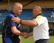 27 June 2010; Tipperary manager John Evans shakes hands with Laois manager Sean Dempsey at the end of the game. GAA Football All-Ireland Senior Championship Qualifier Round 1, Tipperary v Laois, Semple Stadium, Thurles, Co. Tipperary. Picture credit: Barry Cregg / SPORTSFILE