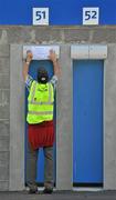 27 June 2010; A Stemple Stadium official tapes up a notice before supporters enter the ground. GAA Football All-Ireland Senior Championship Qualifier Round 1, Tipperary v Laois, Semple Stadium, Thurles, Co. Tipperary. Picture credit: Barry Cregg / SPORTSFILE