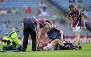 27 June 2010; Westmeath's Derek Heavin is attended to by the team's Chartered Physiotherapist and a member of The St. John Ambulance Brigade of Ireland after suffering a suspected dislocated knee during the game. Leinster GAA Football Senior Championship Semi-Final, Westmeath v Louth, Croke Park, Dublin. Picture credit: Ray McManus / SPORTSFILE
