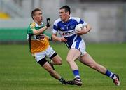 30 June 2010; Liam Kearney, Laois, in action against Conor Lowry, Offaly. ESB Leinster GAA Football Minor Championship Semi-Final, Offaly v Laois, O'Connor Park, Tullamore, Co. Offaly. Picture credit: Brian Lawless / SPORTSFILE