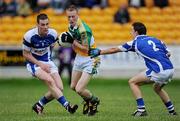 30 June 2010; Peter Cunningham, Offaly, in action against Liam Kearney and Shane Murphy, right, Laois. ESB Leinster GAA Football Minor Championship Semi-Final, Offaly v Laois, O'Connor Park, Tullamore, Co. Offaly. Picture credit: Brian Lawless / SPORTSFILE