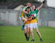 30 June 2010; Offaly's Derek Kelly, centre, Declan Hogan, left, and David Hanlon, celebrate at the final whistle. ESB Leinster GAA Football Minor Championship Semi-Final, Offaly v Laois, O'Connor Park, Tullamore, Co. Offaly. Picture credit: Brian Lawless / SPORTSFILE