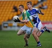 30 June 2010; Peter Cunningham, Offaly, in action against Niall Mullen, Laois. ESB Leinster GAA Football Minor Championship Semi-Final, Offaly v Laois, O'Connor Park, Tullamore, Co. Offaly. Picture credit: Brian Lawless / SPORTSFILE