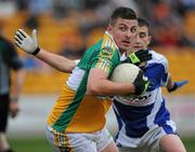 30 June 2010; Derek Kelly, Offaly, in action against Shane McCauley, Laois. ESB Leinster GAA Football Minor Championship Semi-Final, Offaly v Laois, O'Connor Park, Tullamore, Co. Offaly. Picture credit: Brian Lawless / SPORTSFILE