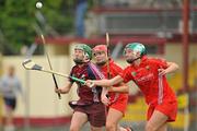 3 July 2010; Orla Kilkenny, Galway, in action against Amanda O'Regan, right, and Anna Geary, Cork. Gala All-Ireland Senior Championship, Galway v Cork, Kenny Park, Athenry, Co. Galway. Picture credit: Diarmuid Greene / SPORTSFILE