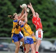 3 July 2010; Aisling Barrett and Brid Stack, Cork, in action against Niamh Keane and Eimear Considine, Clare. TG4 Ladies Football Munster Senior Championship Final, Cork v Clare, Castletownroche GAA Grounds, Castletownroche, Co. Cork. Picture credit: Matt Browne / SPORTSFILE