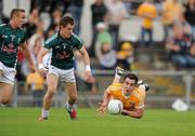 3 July 2010; Kevin Niblock, Antrim, in action against Brian Flanagan, left, and Emmet Bolton, Kildare. GAA Football All-Ireland Senior Championship Qualifier Round 1 Replay, Antrim v Kildare, Casement Park, Belfast, Co. Antrim. Photo by Sportsfile