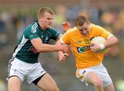 3 July 2010; Paddy Cunningham, Antrim, in action against Peter Kelly, Kildare. GAA Football All-Ireland Senior Championship Qualifier Round 1 Replay, Antrim v Kildare, Casement Park, Belfast, Co. Antrim. Photo by Sportsfile