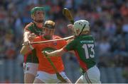 4 June 2016; Cormac Toner of Armagh in action against Pádraig O'Flynn, left, and Shane Boland of Mayo in the Nicky Rackard Cup Final between Armagh and Mayo in Croke Park, Dublin. Photo by Piaras Ó Mídheach/Sportsfile
