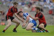 5 June 2016; Shane Carey of Monaghan in action against Conor Maginn, left, and Gerard Collins of Down in the Ulster GAA Football Senior Championship Quarter-Final between Monaghan and Down in St Tiernach's Park, Clones, Co. Monaghan. Picture credit: Dáire Brennan / SPORTSFILE Photo by Daire Brennan/Sportsfile