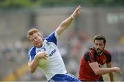 5 June 2016; Kieran Hughes of Monaghan in action against Kevin McKernan of Down in the Ulster GAA Football Senior Championship Quarter-Final between Monaghan v Down in St Tiernach's Park, Clones, Co. Monaghan. Picture credit: Dáire Brennan / SPORTSFILE