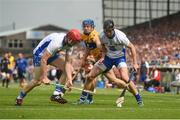 5 June 2016; Shane O'Donnell of Clare in action against Tadhg de Burca, left, and Barry Coughlan of Waterford during the Munster GAA Hurling Senior Championship Semi-Final match between Waterford and Clare at Semple Stadium in Thurles, Co. Tipperary. Photo by Ramsey Cardy/Sportsfile