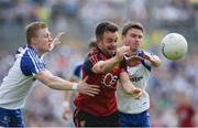 5 June 2016; Mark Poland of Down in action against Colin Walshe, left, and Dessie Mone of Monaghan in the Ulster GAA Football Senior Championship Quarter-Final between Monaghan and Down in St Tiernach's Park, Clones, Co. Monaghan. Photo by Daire Brennan/Sportsfile